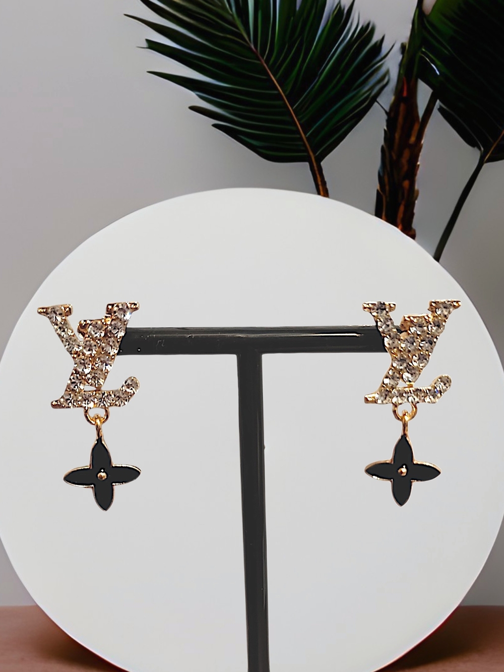 Gold Crystal Logo Drop Earrings with Black Flower Charm